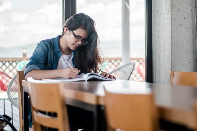 Best AI tools for government exam preparation – student studying with books and digital devices