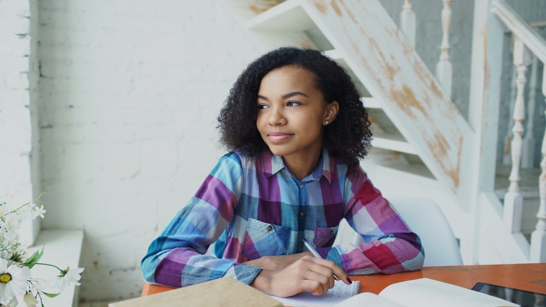 Student preparing notes and revising for exams with study material